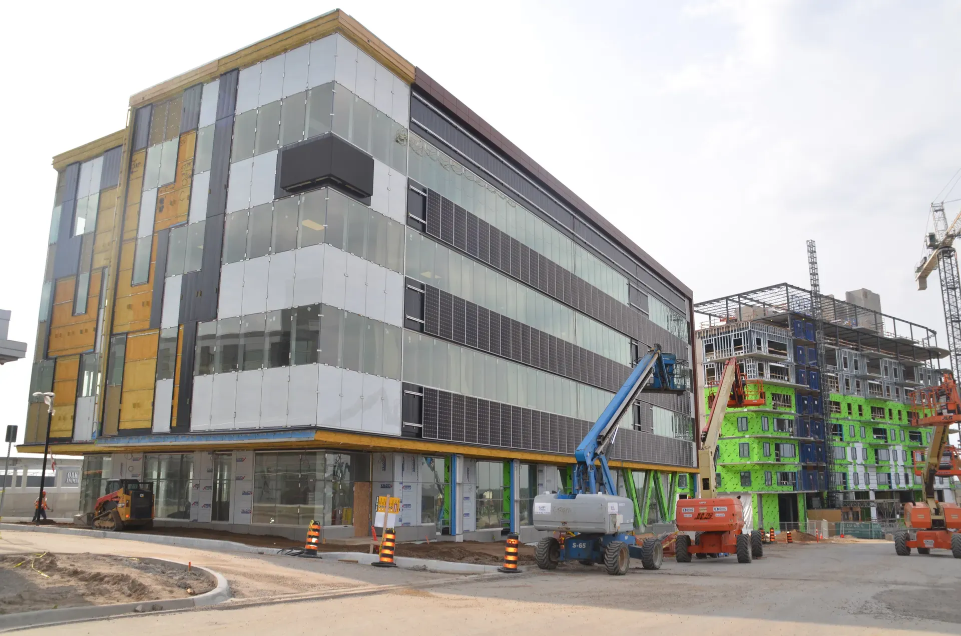Mid-rise building with exterior insulation and membrane in progress