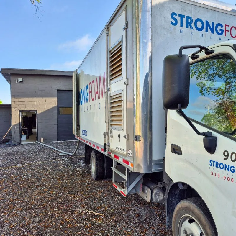Strong Foam spray rig truck parked outside the shop