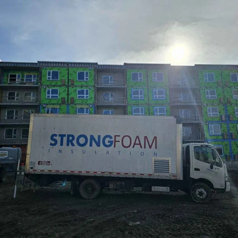 Strong Foam spray rig truck at a multi-storey jobsite